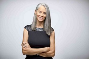 Older woman with straight, thick natural grey hair