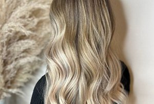 Woman with soft, beige blonde ombre