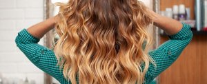 Woman with long golden blonde and brunette ombre hair