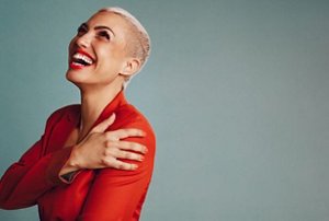 Laughing woman with a very short pixie cut