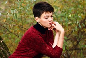 Young woman with a classic short pixie cut