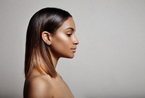 Young woman with straightened chin-length hair with ombre ends