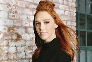 Woman with pale skin and red hair