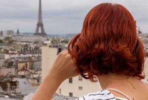 Woman with short, dyed copper hair