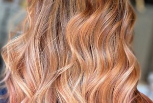 Long blonde hair with a light golden rose gold tint