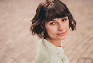 Brunette woman with a layered wavy bob