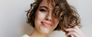 Smiling woman with a wavy short bob hairstyle