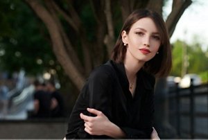 Woman with an angled, slicked-back lob