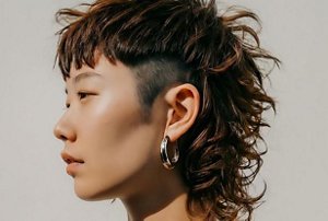 Woman with a mid-length wolf cut