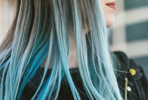 Woman with long blue ombre hair