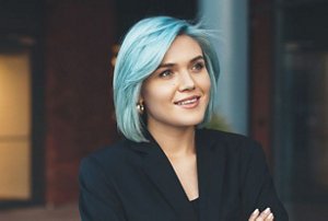 Woman with light blue hair cut into a mid-length bob