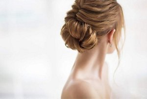 Elegant young woman with a frizz-free chignon hairstyle
