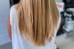 Long hair cut into a v-cut with layers