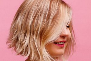 Blonde woman with a disconnected choppy lob