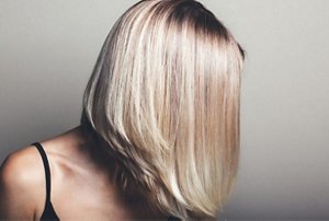 Woman with a mid-length angled lob