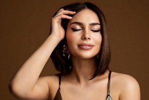 Woman with a square face shape with a sharp, angled brunette bob