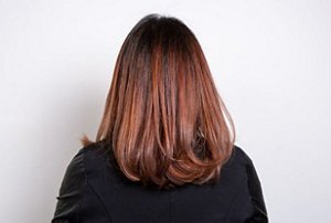 Woman with blue-toned red hair