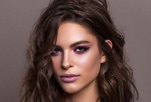 Brunette woman with a kitty cut hairstyle