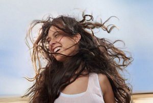 Women with wavy hair having fun outside