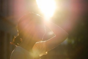 Woman enjoying an outdoors party in the summertime