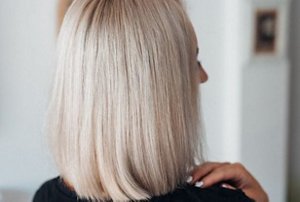 Blonde woman with sleek mid-length bob