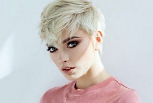 Blonde woman with sleek, tapered pixie cut