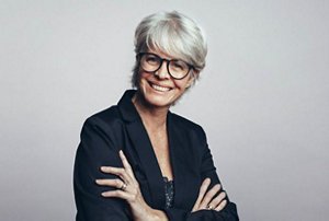 Professional woman with a feathered pixie cut