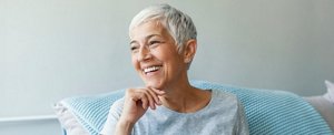 Smiling woman in her 60s with an elegant short haircut