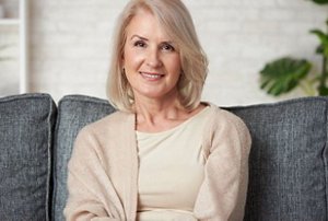 Smiling older woman with feathered layered haircut