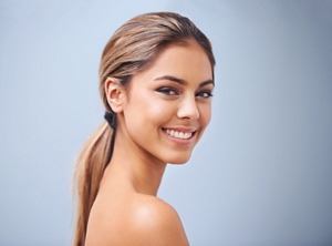 Blonde woman with a side ponytail