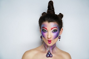 Woman with unicorn horn hair with festival make up