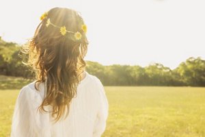 Hispanic woman wearing flower crown outdoors
