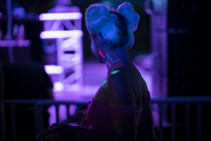 Woman at a rave with space buns hairstyle