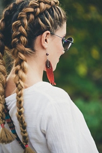 Woman with long Dutch braids wearing glasses