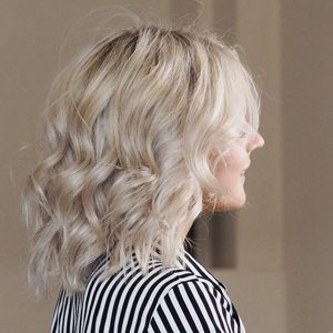woman with grey hair looking into camera