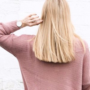 woman with grey hair looking into camera