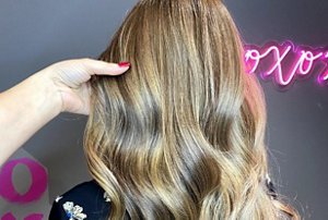 Woman with dark blonde sombre hair