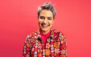 Woman with lilac hair styled into a textured, choppy pixie cut