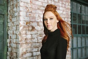 Redheaded woman with pale skin 