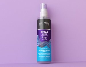 Dream Curls Oil-Infused Wave-Revitalising Spray against a purple background