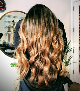 Honey and caramel balayage on black hair