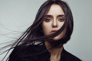 Woman with black hair with subtle highlights