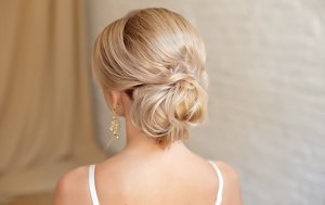 Blonde bridesmaid with a chignon hairstyle
