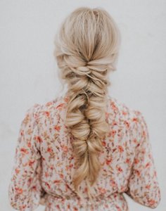 Blonde bridesmaid with fishtail braid hairstyle