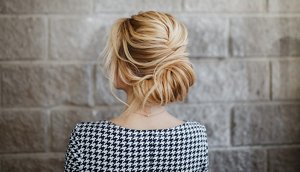 Bridesmaid with an elegant French twist hairstyle