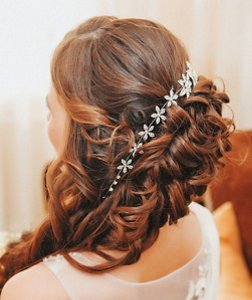 Bridesmaid with a side-swept updo hairstyle