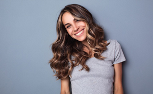 Smiling woman with bronde money pieces and brunette hair