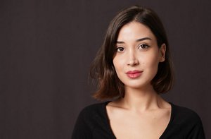 Attractive brunette woman with a mid-length asymmetrical haircut