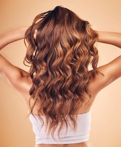 Young brunette with silky, brushed-through mermaid waves