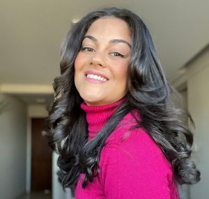 Young woman with black hair with a voluminous butterfly haircut
